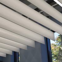 White paper lamellas of the Drop Stripe® ceiling system 
