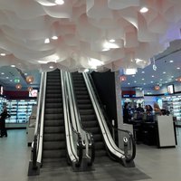 Lamellar ceiling made of architectural paper for Rive Gauche stores 