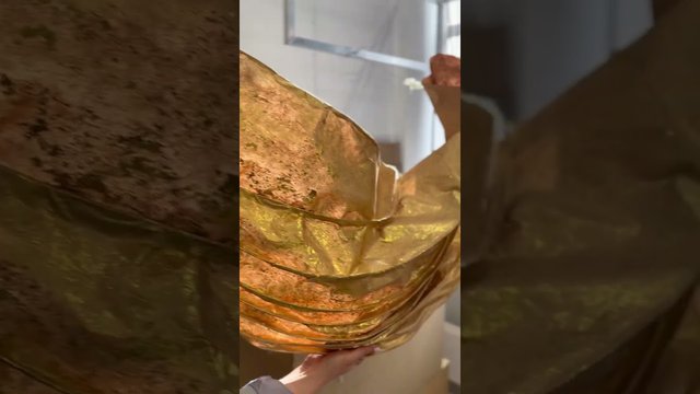 Giant golden leaves and petals made from architectural paper 
