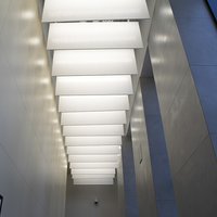 Lamellas in a narrow corridor ceiling design 