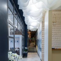 The white lamellar ceiling in the hotel lobby 