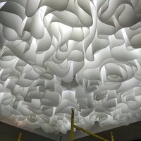 Wave ceiling system in a lobby of a sanatorium 