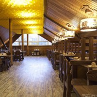 Yellow honeycomb ceiling in a wooden building. Berloga restaurant 