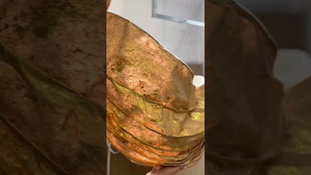 Giant golden leaves and petals made from architectural paper 